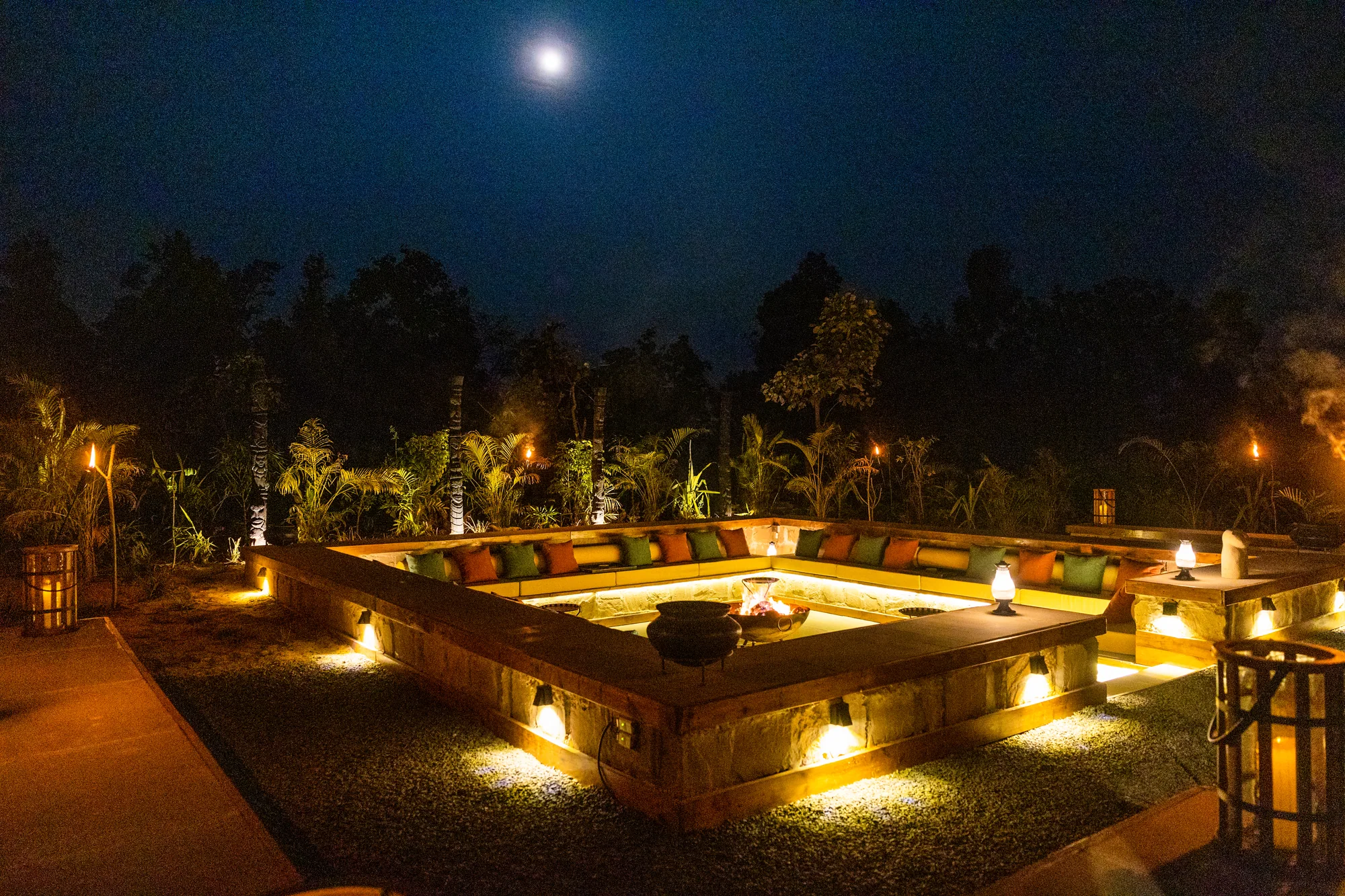 Founders Camp glowing under a moonlit sky